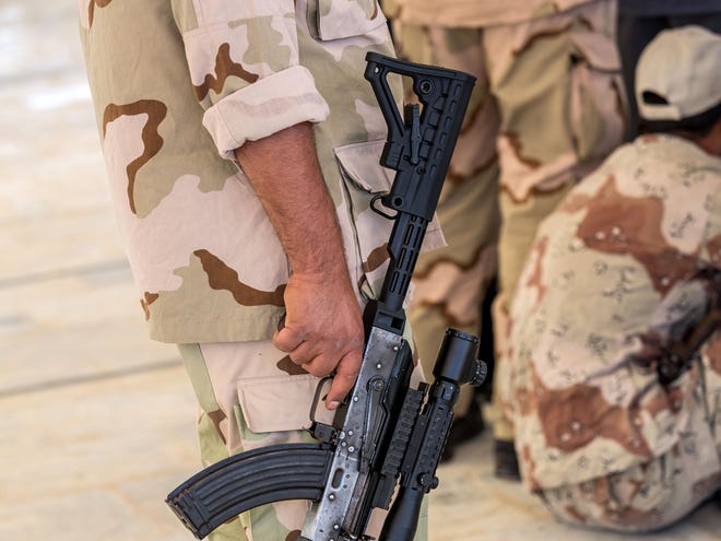 A member of an Iraqi volunteer force holds a weapon during training in the Shiite holy city of Karbala, 50 miles (80 kilometers) south of Baghdad, Iraq, Tuesday, June 24, 2014. Iraq's top Kurdish leader warned visiting Secretary of State John Kerry on Tuesday that a rapid Sunni insurgent advance has already created "a new reality and a new Iraq," signaling that the U.S. faces major difficulties in its efforts to promote unity among the country's divided factions. The U.N., meanwhile, said more than 1,000 people, most civilians, have been killed in Iraq so far this month, the highest death toll since the U.S. military withdrew from the country in December 2011.