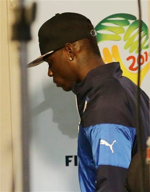Italy forward Mario Balotelli walks away after the group D World Cup soccer match between Italy and Uruguay at the Arena das Dunas in Natal, Brazil, Tuesday, June 24, 2014. Uruguay won 1-0. Uruguay won 1-0. The four-time champion Italy is heading home after the group phase for a second time in four years. Head coach Cesare Prandelli and football federation president Giancarlo Abete both resigned moments after the match. (AP Photo/Antonio Calanni)