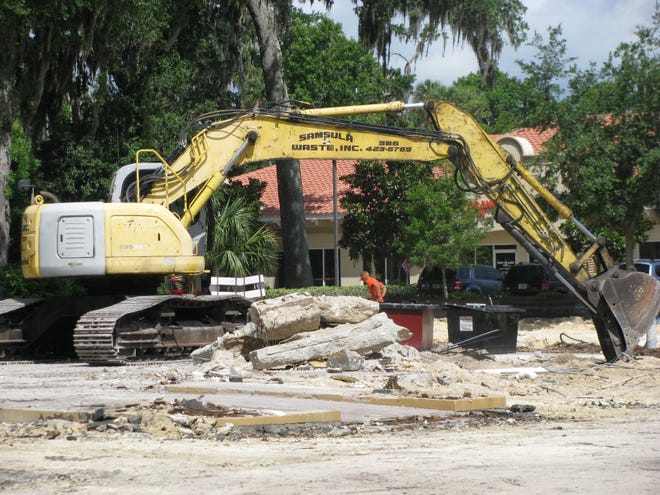 Workers clear away the final remains of the former Asian Fusion restaurant building along Dunlawton Avenue in Port Orange to make way for construction of the first Wawa convenience store/gas station in the Volusia-Flagler area.
