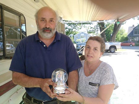 Mike and Kim Gould hold the snow globe belonging to their late son.