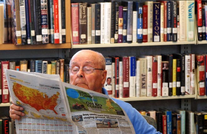 Anthony Bernier, 84, of Havelock, reads the newspaper Tuesday at the Havelock-Craven County Public Library. Bernier said he comes to the library every day to read the paper and considers the facility vital to the community.