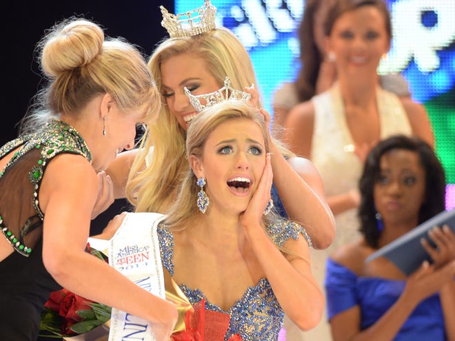 Miss Greater Easley Teen, Hope Harvard, reacts while being crowned Miss South Carolina Teen Friday night at the Township Auditorium in Columbia.