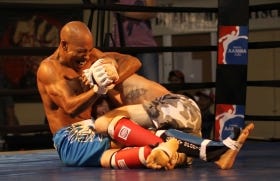 Amar Cox (left) puts a submission move on Howard Medors during Saturday's mixed martial arts event at Ketterlinus Gym in this June 2011 photo. Saturday, the Rumble in the Ancient City Summer Slam will be held at Ketterlinus Gym. The doors open at 5 p.m. and the event starts at 6 p.m.
