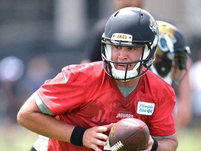 Blake Bortles (5) hands off in the OTA. The Jacksonville Jaguars held their first OTA at Florida Blue Health and Wellness Practice Fields on Tuesday, May 27, 2014, in Jacksonville.