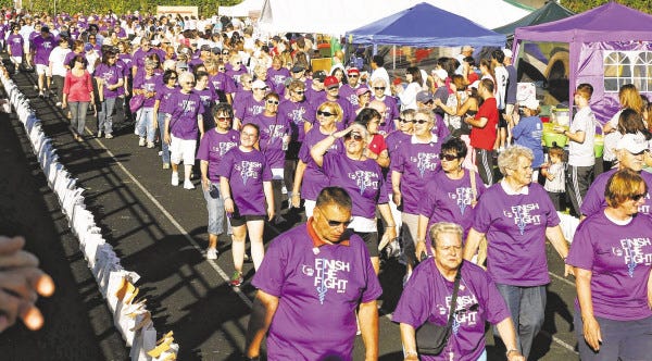 Cancer survivors fill the track Friday evening at Paul F. Walsh Field during the Relay for Life of Greater New Bedford.