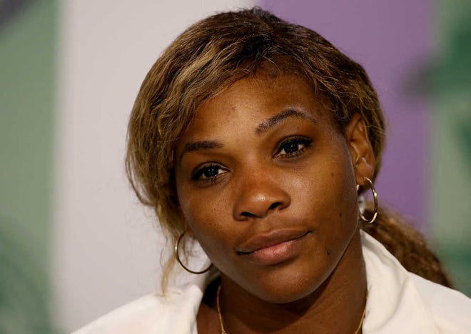 Serena Williams of the U.S attends a press conference after losing to Alize Cornet of France at the All England Lawn Tennis Championships in Wimbledon, London, Saturday June 28, 2014. (AP Photo/AELTC, Scott Heavey)