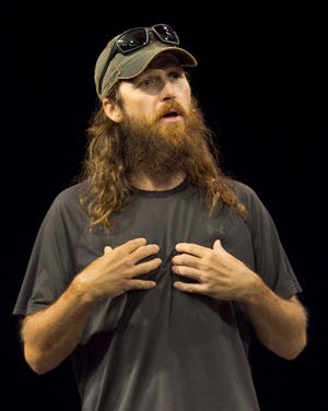 Jase Robertson, star of the reality TV series "Duck Dynasty," speaks before a capacity audience of approximately 3,600 people at the Family Worship Center in Lakeland on Sunday morning.