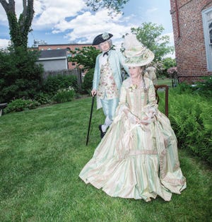 Amy Donle photo
Living history re-enactors Adam and Mary Spencer participate in a costume tea held June 21 at the Warner House in Portsmouth. The museum is exploring a concept popular in other New England towns and cities to ascertain whether costume re-enactors would like to use the house, a national historic landmark, for themed events.