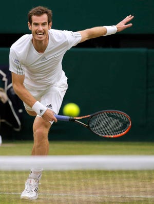 Andy Murray of Britain serves to Kevin Anderson of South Africa during their men's singles match at the All England Lawn Tennis Championships in Wimbledon, London, Monday, June 30, 2014. (AP Photo/Pavel Golovkin)