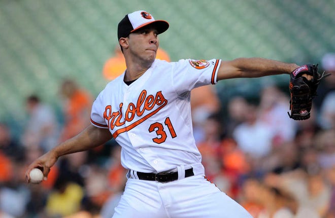 Baltimore Orioles pitcher Ubaldo Jimenez delivers against the Texas Rangers in the first inning of a baseball game, Monday, June 30, 2014, in Baltimore. (AP Photo/Gail Burton)