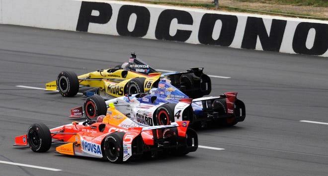 Cars drive around the track during 2013's Pocono Indycar 400.