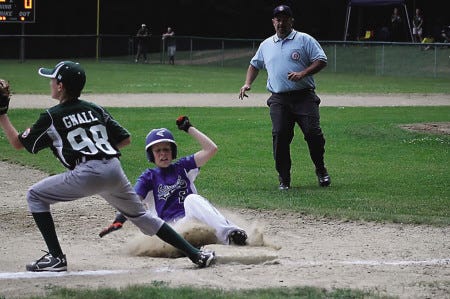 Courtesy photo
Seacoast’s Hayes Waddell slides safely into third base during Sunday’s championship game against Dover in the District 7 Cal Ripken All-Star tournament in Madbury.