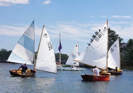 Sailors approach Round Island for the first lap during the third annual Round Island Regatta to benefit the Coastal Conservation Association on Saturday.