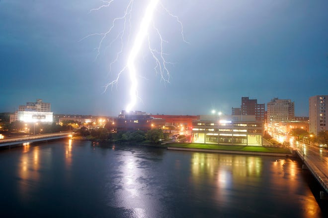 A lightning bolt strikes over downtown Rockford shortly after 8:30 p.m. Monday, June 30, 2014, as a strong storm moves through Winnebago County.