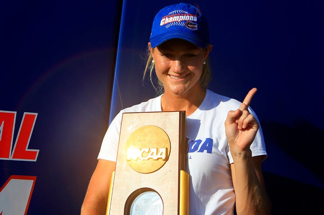 Hannah Rogers poses for photos with the NCAA championship trophy during a celebration at Katie Seashole Pressly Stadium on June 4. The Gators defeated Alabama in a best of three series to win the program's first national championship.