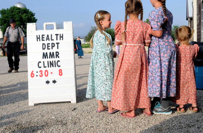 Young Mennonite girls gather at the health and safety clinic, which included measles, mumps and rubella vaccinations in Shiloh on June 25. Health officials said Ohio’s current outbreak of measles consists of more than 360 cases and is the biggest in the U.S. since 1994.