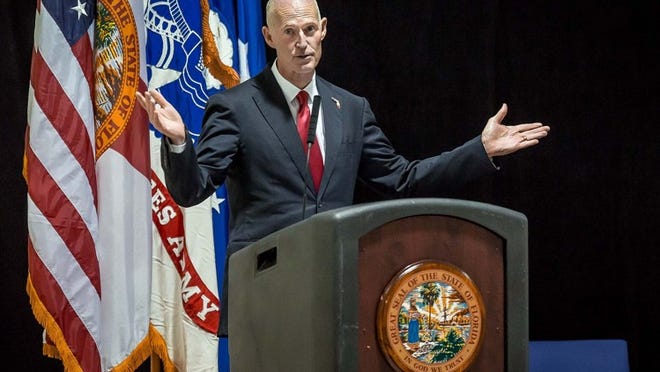 Florida Gov. Rick Scott talks about his time in the Navy before an awards ceremony at the U.S. Army Reserve Headquarters, 3220th US Army Garrison, west West Palm Beach on Tuesday July 1, 2014. (Thomas Cordy / The Palm Beach Post)