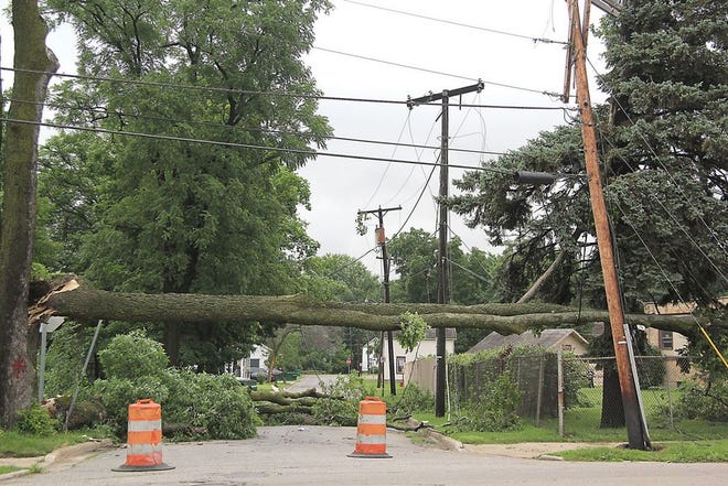 Several streets in the City of Three Rivers were left impassable by fallen trees and downed power lines Tuesday. Pictured is a side street off of South Main.