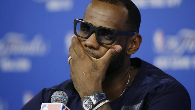 The Heat’s LeBron James wouldn’t deal Sunday night with questions about whether he will opt out of his contract. “Me and my team will sit down and deal with it. I love Miami. My family loves it. But obviously right now that’s not even what I’m thinking about.” (AP Photo/Tony Gutierrez)