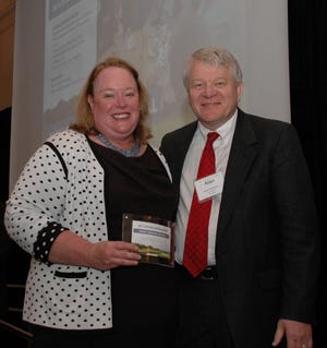 Nancy Paschall, left, receives one of 19 North Carolina Bar Association Citizen (NCBA) Lawyer Awards from NCBA President Alan Duncan on June 20.