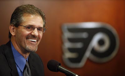 New Philadelphia Flyers general manager Ron Hextall laughs during an NHL hockey news conference, Wednesday, May 7, 2014, in Philadelphia. Hextall is Philadelphia's all-time winningest goalie and served as assistant GM last year before being promoted. He replaces Paul Holmgren who was elevated to president. (AP Photo/Matt Slocum)