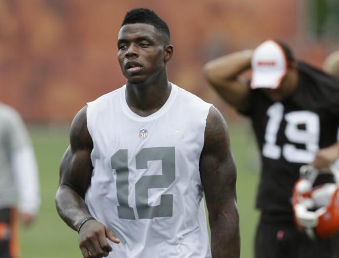 Cleveland Browns wide receiver Josh Gordon walks off the field after organized team activities at the NFL football team's facility in Berea, Ohio Tuesday, June 3, 2014.