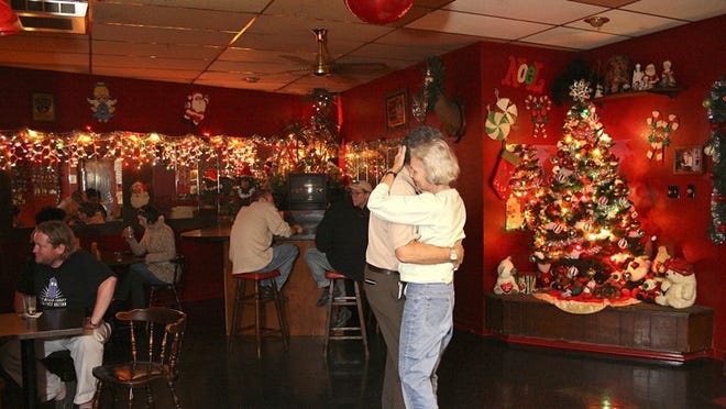 File photo: A couple enjoys a romantic dance among the festive decor at Lala’s in 2008.