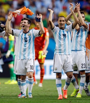 Argentina’s Lionel Messi (10) and his teammates celebrate following their 1-0 victory over Belgium to advance to the semifinals after the World Cup quarterfinal match at the Estadio Nacional in Brasilia, Brazil, Saturday.