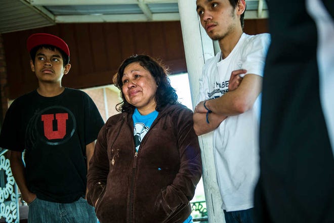 In this April 16, 2014 photo, Ana Cañenquez, center, and her sons Erick Ramirez, 13, and Geovanny Ramirez, right, 17, talk about the possibility of being deported at her home in Garland, Utah. Cañenquez and four of her seven children were originally ordered to leave the United States and return to El Salvador by March 21. That date was pushed back, and now there's no specific deadline for them to leave. (AP Photo/The Salt Lake Tribune, Chris Detrick)
