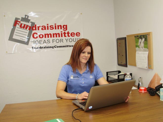 Nicole Sdao, founder and president of Fundraising Committee, works full time for her startup business Tuesday, July 1, 2014,in her office in the basement of Freeport Family Chiropractic.