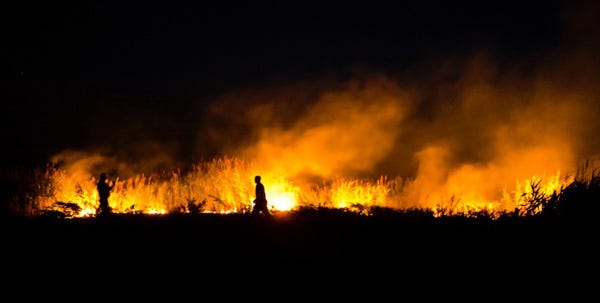Embers from a public fireworks display at Rock Harbor in Orleans apparently ignited a brush fire on the Eastham side of the harbor at about 9 p.m. Sunday, according to police and fire officials.