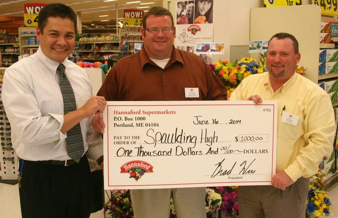 Under the Hannaford Helps Schools program, the Rochester grocery store, with outlets at the Lilac Mall and North Main Street has been able to help over 20 schools in the area. In addition, Spaulding High School, this week, received a bonus check for $1,000, which will go into a special fund to meet students’ needs. From left are Spaulding Principal Peter Weaver, the Lilac Mall Hannaford assistant manager Steve Leonard and the store’s manager, Gary Nadeau.