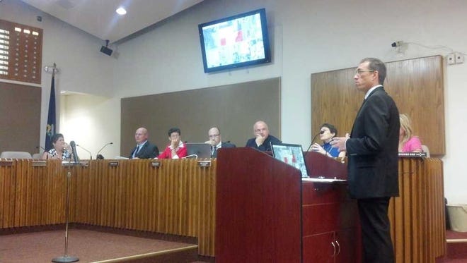 Topeka planning director Bill Fiander speaks before the city's governing body Tuesday evening in support of a proposed rezoning on the city's western edge.