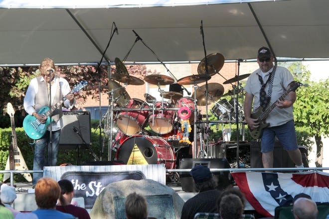 The twisted rock band The Steve's performs for a large audience at Four Corners Park in Coldwater on Tuesday. The band's show was the second in the annual Entertainment Under The Stars series. CHRIS WORST PHOTO
