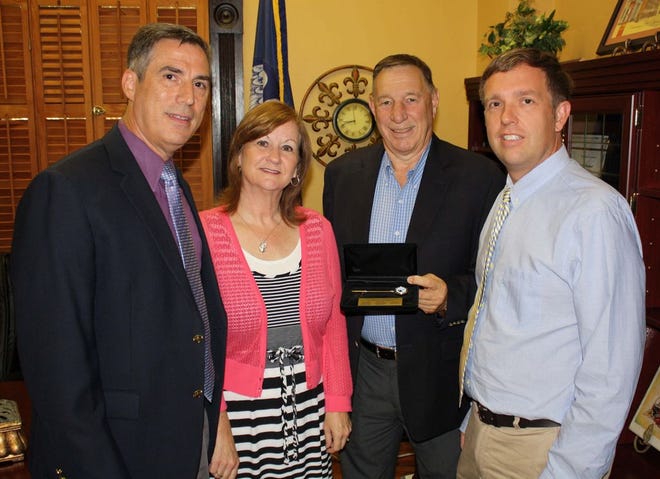 (From left to right) Paul and Darlene Taranto, Ascension Parish President Tommy Martinez and Ranji Bercegeay are shown with a Parish of Ascension key that will be presented to representatives from the Nova Scotia community of Tusket later this month. Bercegeay will perform in “Evangeline, the Musical,” with members from Nova Scotia later this month. Paul wrote the music and lyrics for “Evangeline” while Darlene is the producer. The Tarantos hope to open dialogue between the Nova Scotia community and Ascension Parish because of the historical ties shared by both communities.