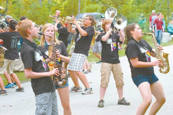 Members of the Lutheran Vanguard Marching Band entertained campers with music and a few dance moves during Mackinaw Mill Creek Camping's 50th Anniversary celebration parade Tuesday night.
