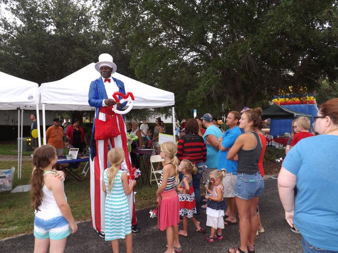 Major Hefflin put his own twist on the event with a little balloon magic in the Patriotic Kids Corner where rain could not dampen the spirits of those celebrating the 4th of July.