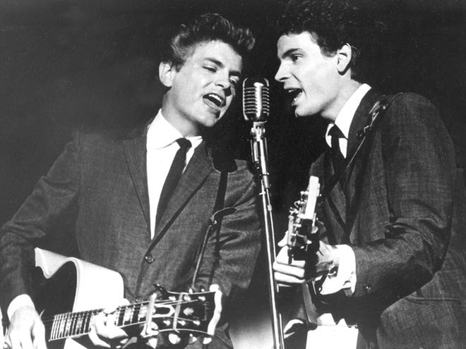 This July 31, 1964, photo shows Don Everly and Phil Everly of The Everly Brothers during a performance. The Rock and Roll of Fame will honor the Everly Brothers with a tribute concert this fall.