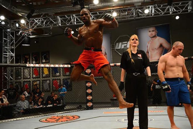 Corey Anderson of Rockton celebrates after defeating Kelly Anundson in their elimination fight during filming of season 19 of The Ultimate Fighter on October 16, 2013 in Las Vegas. PHOTO PROVIDED