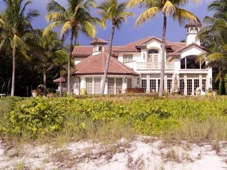 Gov. Rick Scott's 4,900-square-foot house on Gordon Drive in Naples, as seen from the beach. Online real estate sites such as Zillow and Trulia offer widely varying estimates of the property's value. Scott paid $11.3 million for the house, on 1.25 acres, in 2003. Gordon Drive, across from Naples' tony Port Royal section, features some of the most expensive real estate in Florida.