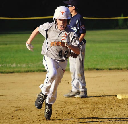 Ryan O’Leary photo 
Stratham’s Ben Evans circles the second base bag during Wednesday’s 11-year-old Cal Ripken All-Star 60-foot state tournament game against Exeter at Stratham Hill Park. Stratham won, 9-3.
