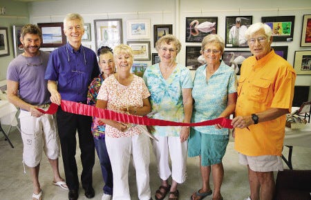 Hampton artists cut the ceremonial ribbon at the newly opened Hampton Arts Network Summer Art Show, located at 367 Ocean Boulevard in the Oceanside Mall on Hampton Beach. From left are Skip Windemiller, Don Jenkins, Jan Meades, Linda Gebhart, Peg Duffin, Ann Justin and John Gebhart.



Rich Beauchesne photo