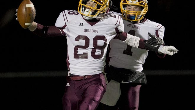 Thorndale teammates Colton Austin, left, and Dillon Bankston, celebrating a touchdown against Shiner last season, are receivers on the Bulldogs’ 7-on-7 team that is competing at the state tournament this week.