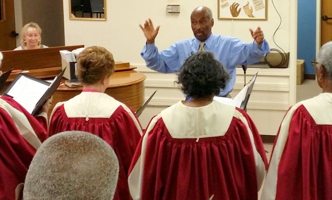 Jesse Chapman, shown directing the choir, is retiring after 15 years serving as the director of music and fine arts for the Palm Coast United Methodist Church.
