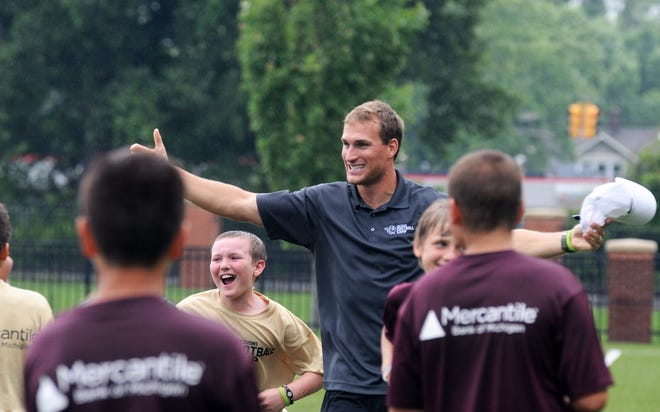 Washington Redskins quarterback Kirk Cousins celebrates a winning touchdown with participants of his youth camp Saturday at Hope College's Van Andel Soccer Stadium. Michael Appelgate/Sentinel staff