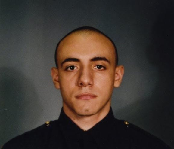 This photo provided by the Jersey City Mayor's office shows Officer Melvin Santiago. Santiago was shot in the head while still in his police vehicle as he and his partner responded to an armed robbery call at a Walgreens Pharmacy at about 4.a.m., Jersey City Mayor Steven Fulop said in a statement. Fulop says Santiago was pronounced dead at Jersey City Medical Center. No other details about the officer were immediately released. Fulop said officers responding to the robbery call shot and killed the man who shot Santiago. He was not immediately identified. (AP Photo/Jersey City Mayor's office)