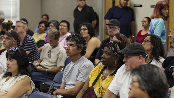 Residents from flood prone areas near Onion and Williamson creeks pack a room in Perez Elementary in Southeast Austin Saturday to get information on the city’s plans to buyout some homes.