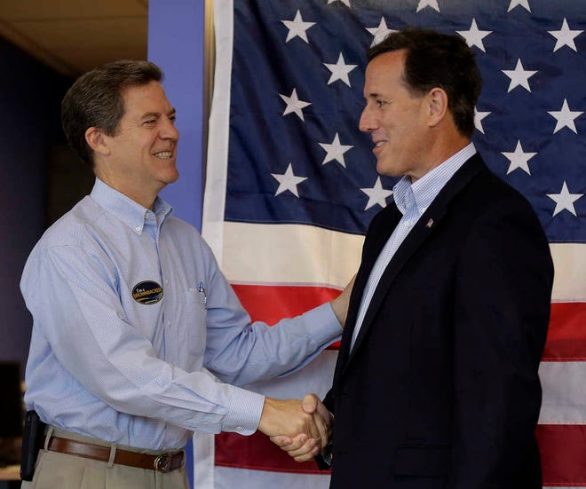 Gov. Sam Brownback received the endorsement of former GOP presidential candidate Rick Santorum at a campaign rally Monday in Olathe.