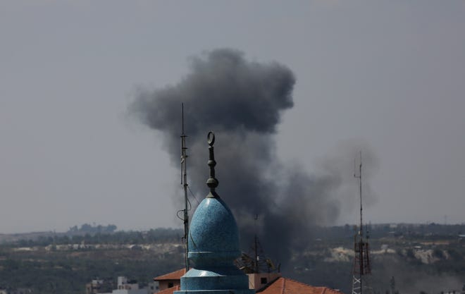 Smoke rises after an Israeli missile strike in Gaza City.