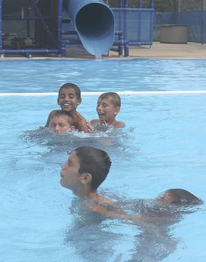 A group of boys beat the heat by swimming at Heritage Pool in Coldwater on Monday. CHRIS WORST PHOTO